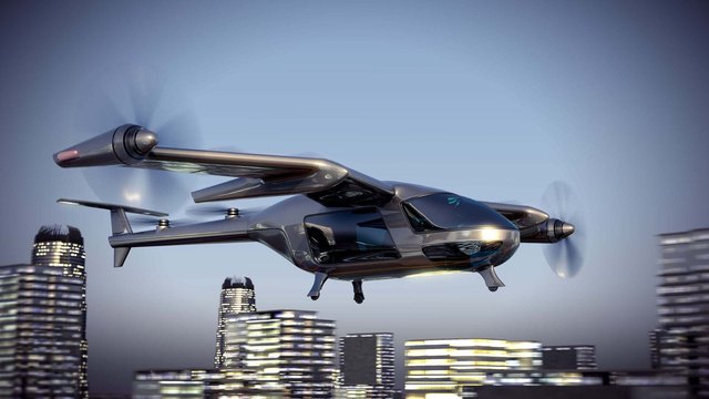 eVTOL air vehicle flying over a city